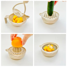 Load image into Gallery viewer, Multifunctional baby food prepping kits. Squash in mashing bowl, zucchini on grater, orange on juicer, and mixed fruit juice drained on strainer.