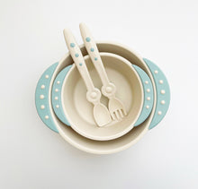 Load image into Gallery viewer, Bowls with blue handles stacks together and baby utensils with blue beads are in the smaller bowl.
